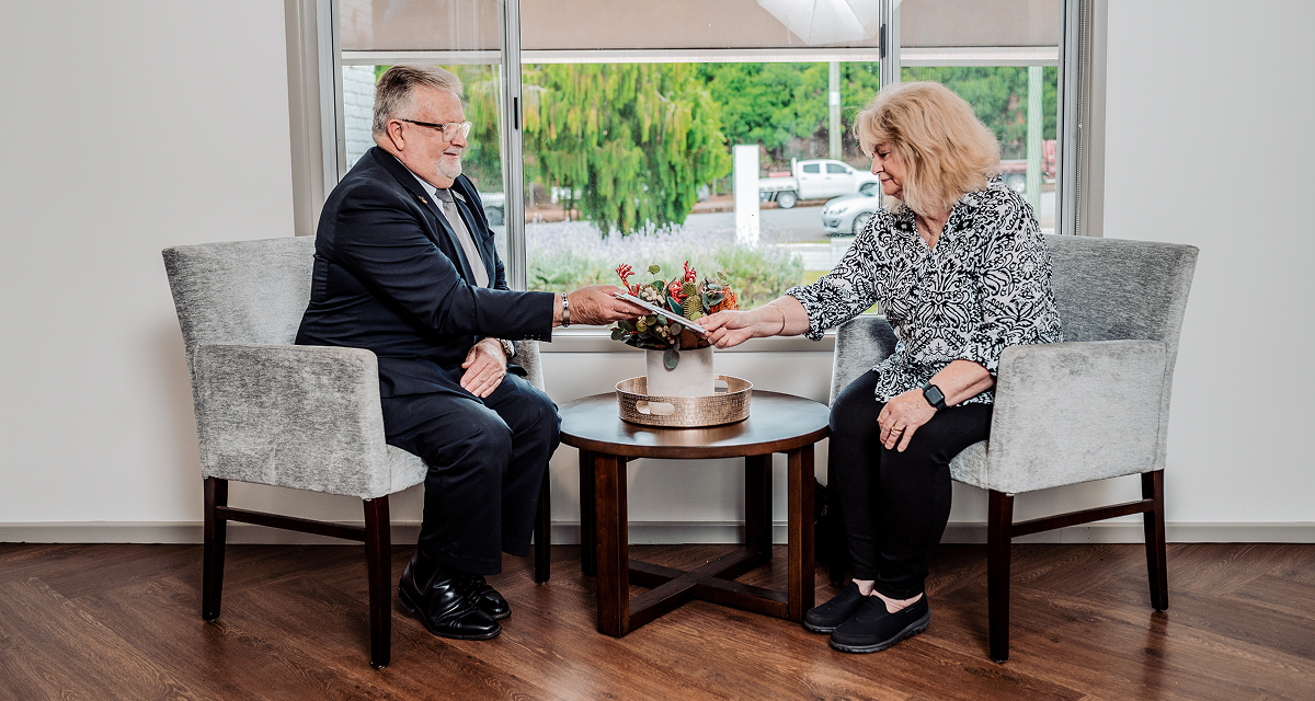 Hiram Philp funeral director with woman