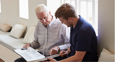 two men looking at a photo album
