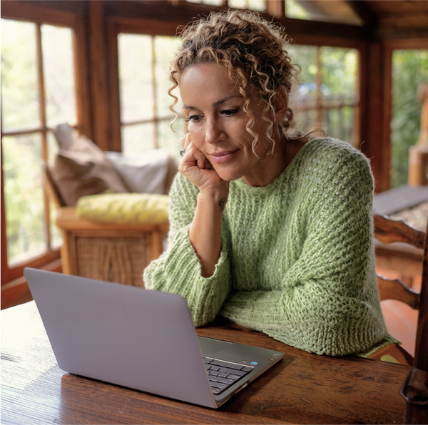 woman looking at laptop