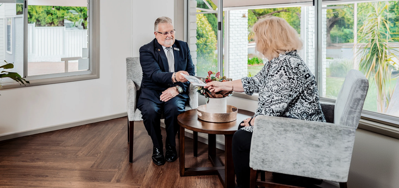 Hiram Philp funeral director with woman
